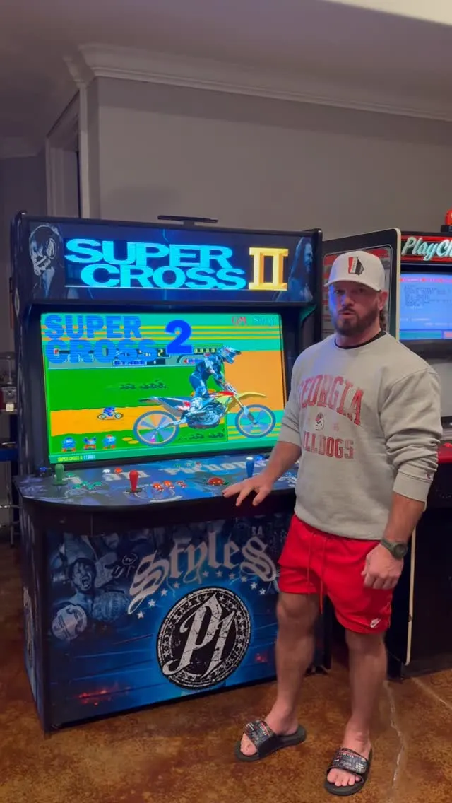 AJ Styles with the Phenomenal Build arcade